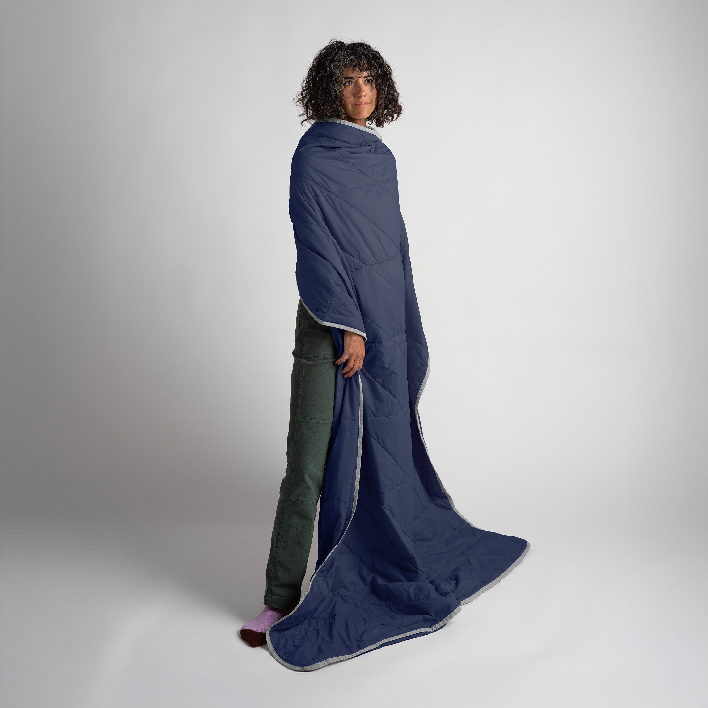 Gravel Layover XL Travel Blanket Packable Puffy Blue — essential long-haul travel comfort gear at Sun of the Beach Boutique