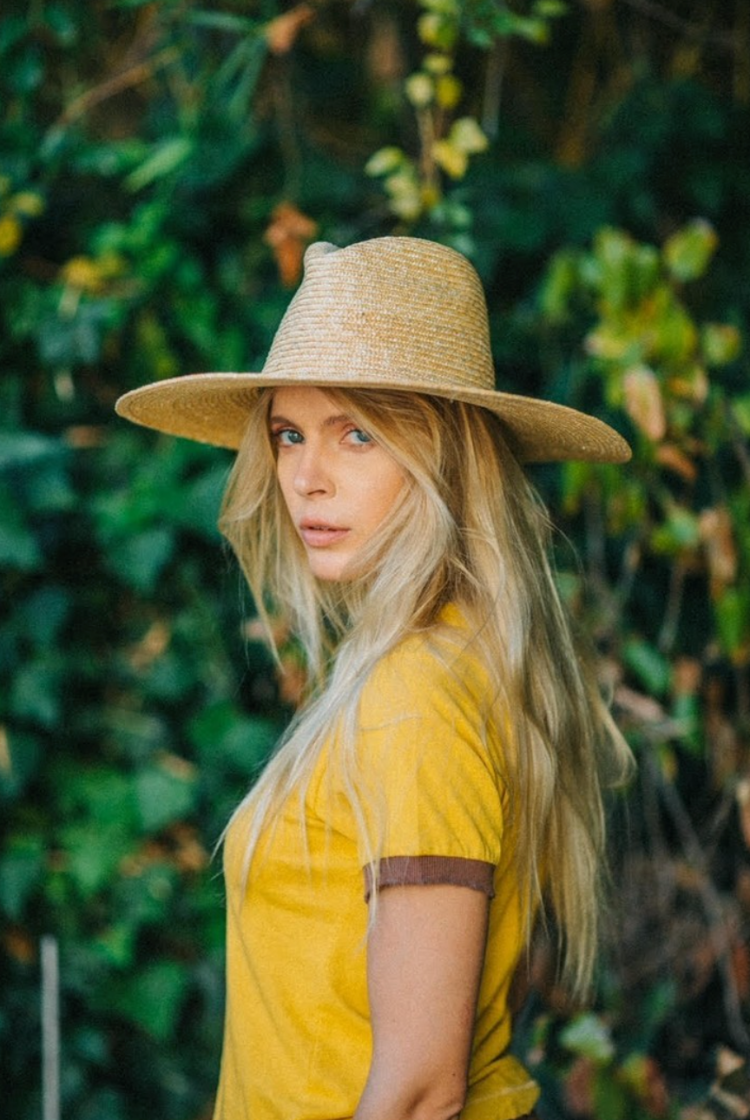 lady wearing yellow shirt and straw hat