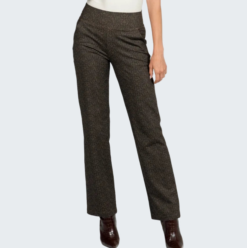 Brown checkered pants worn by a person on a white background