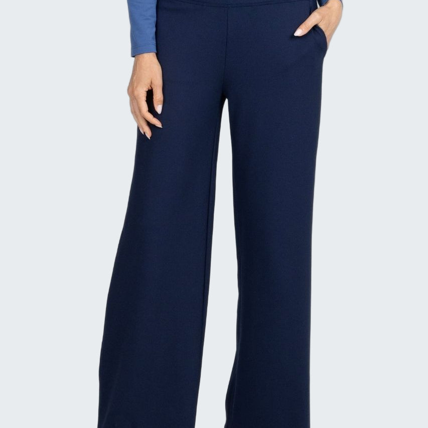 Navy blue wide-leg pants worn with a blue top on a white background