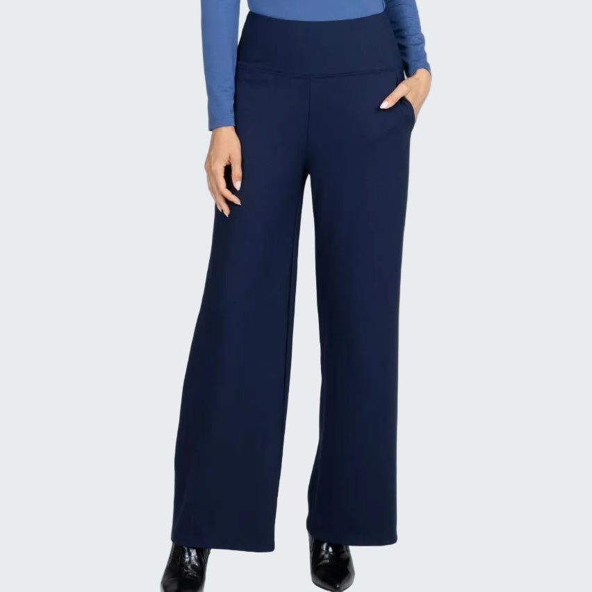 Navy blue wide-leg pants worn with a blue top on a white background