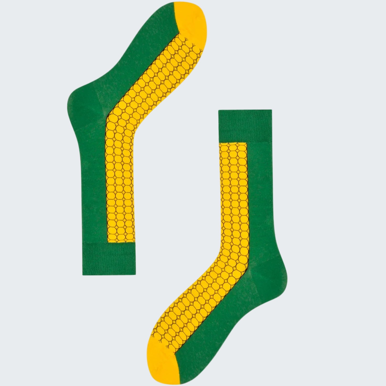 Green and yellow socks with corn design on a white background