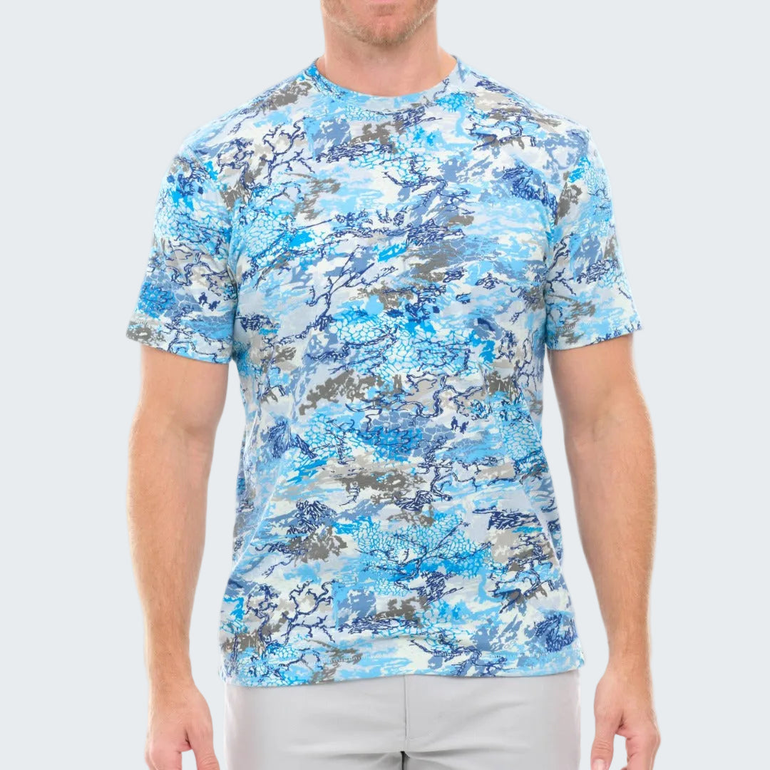 Person wearing a blue camouflage t-shirt on a white background