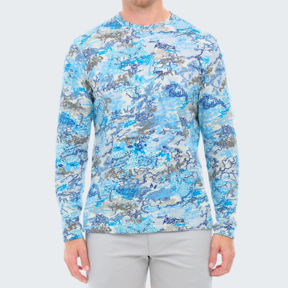 Person wearing a blue camouflage long-sleeve shirt on a white background