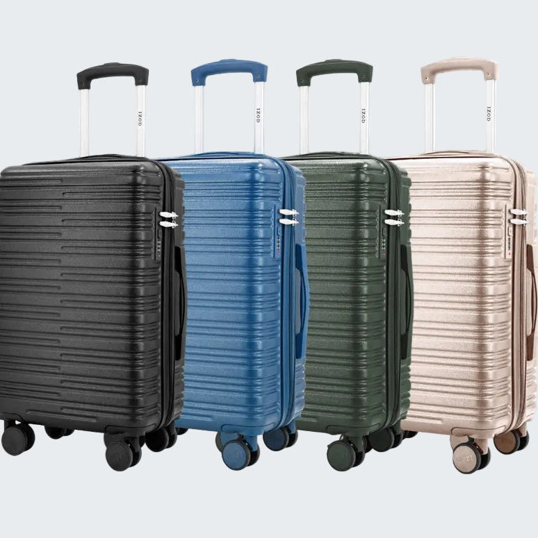 Four suitcases in black, blue, green, and beige on a white background