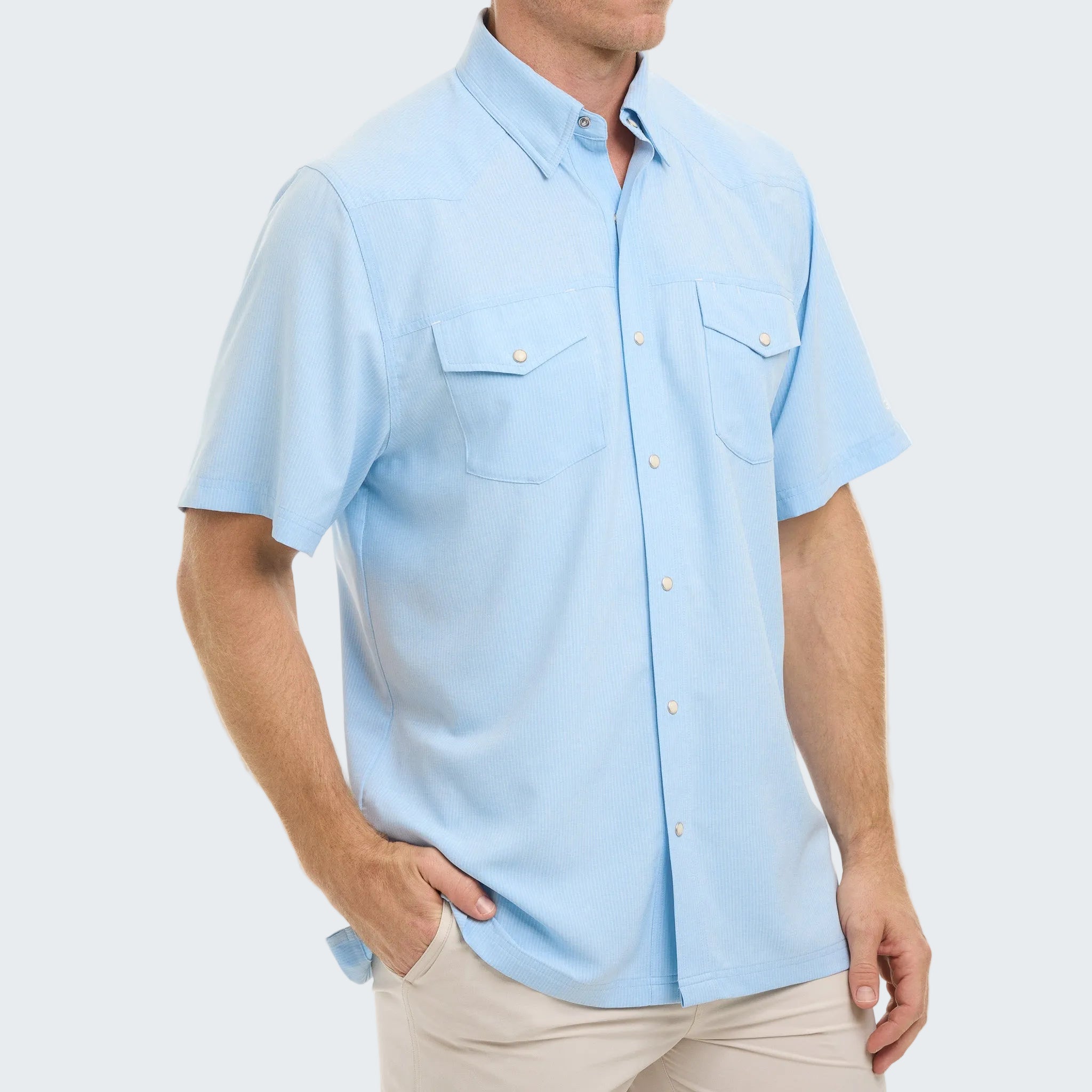 Man wearing a light blue short-sleeve shirt on a white background