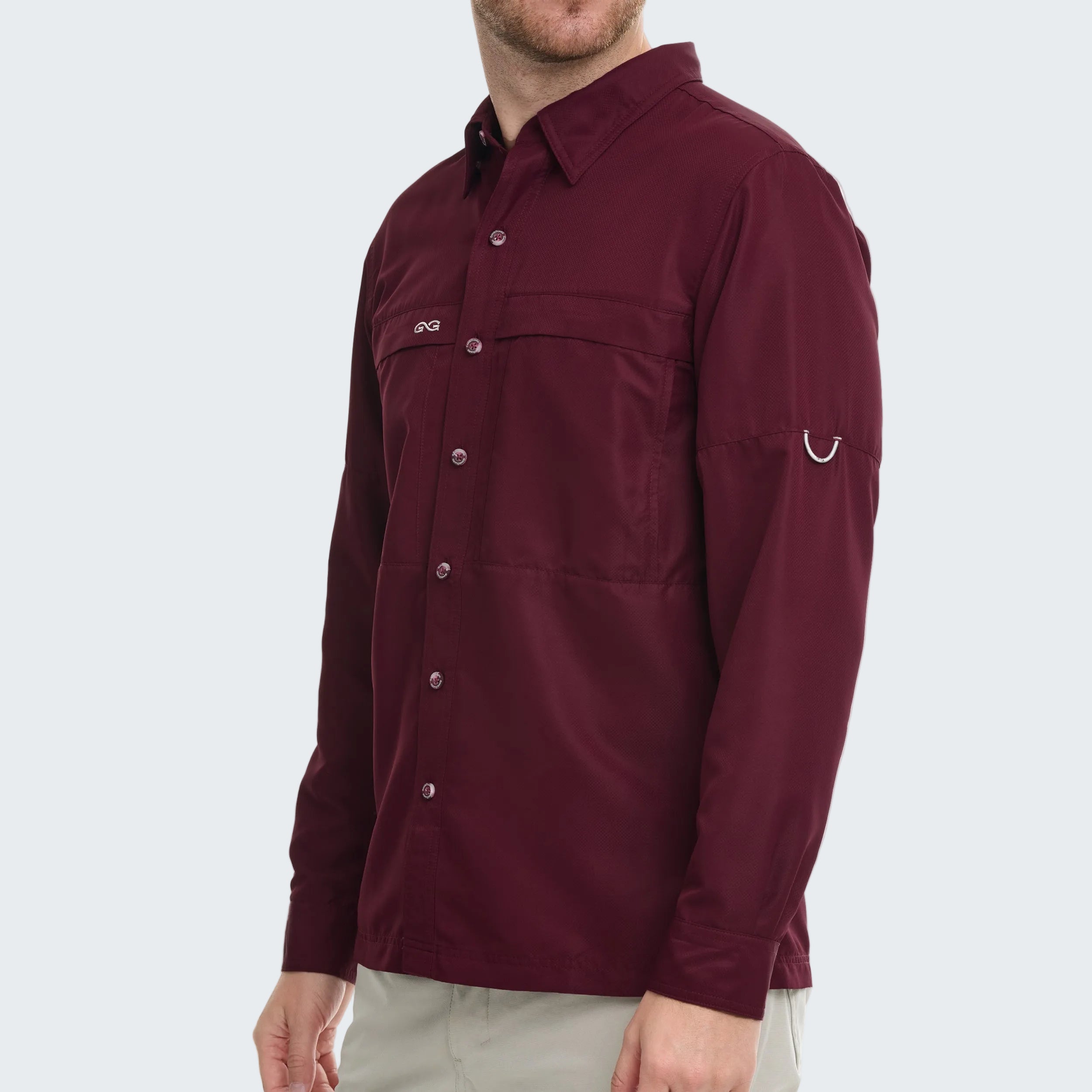 Maroon shirt worn by a person on a white background