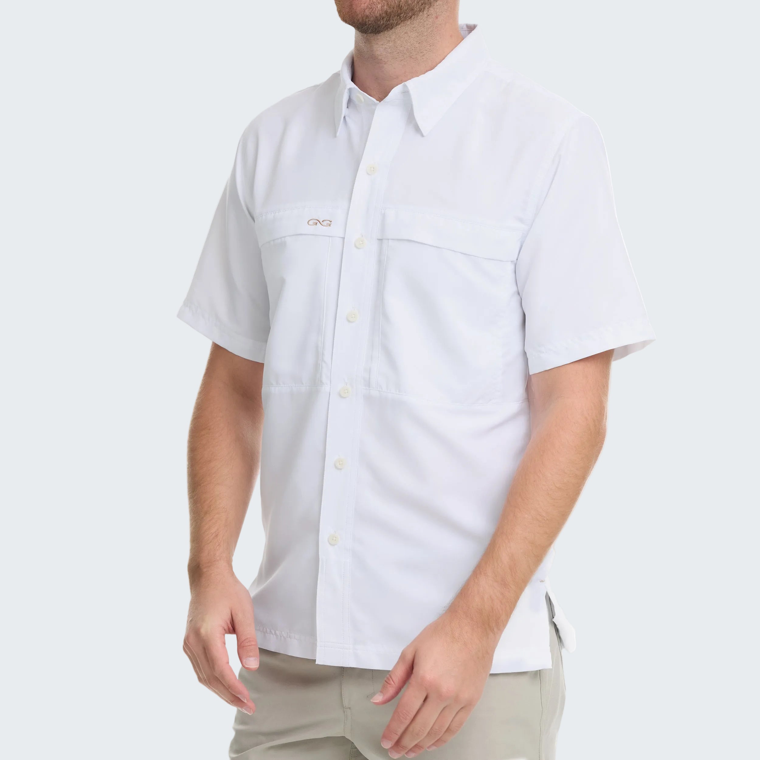 Man wearing a white short-sleeve button-up shirt on a white background