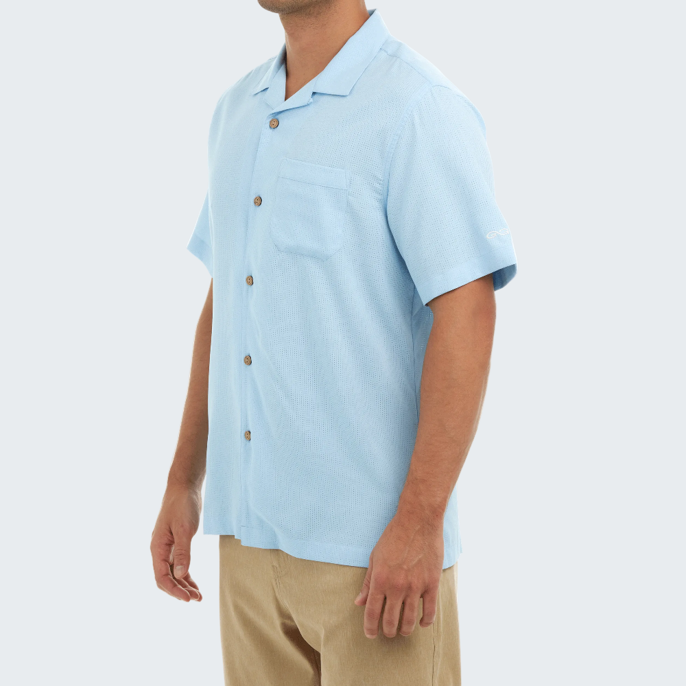 Light blue short-sleeve shirt worn by a person on a white background