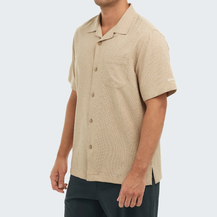 Man wearing a beige short-sleeve shirt on a white background