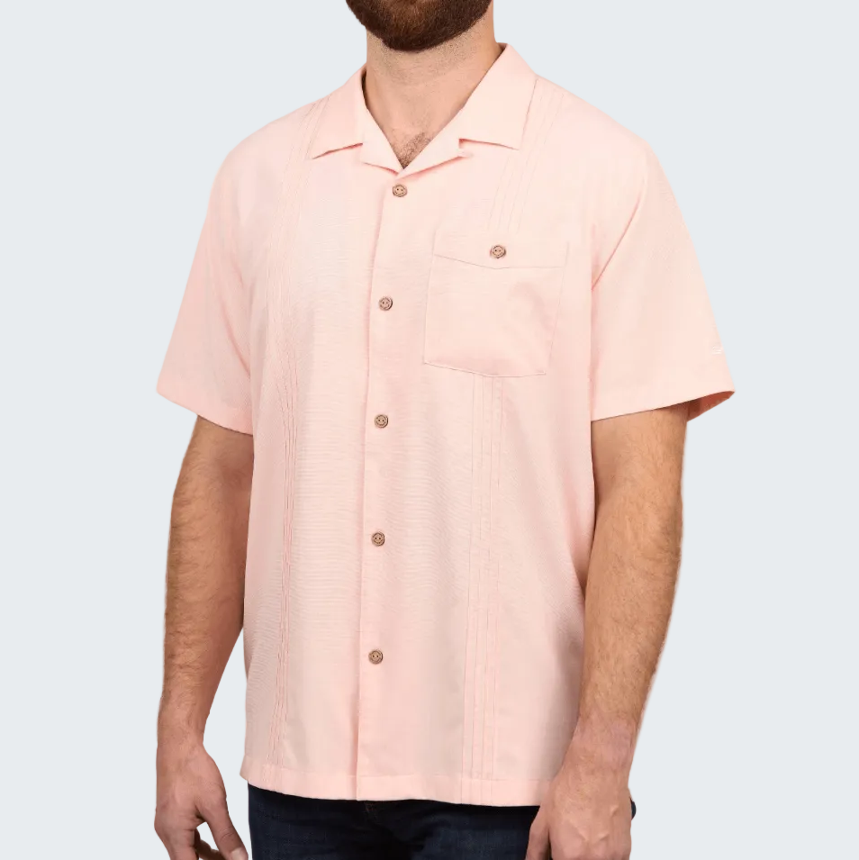 Man wearing a light pink short-sleeve shirt on a white background