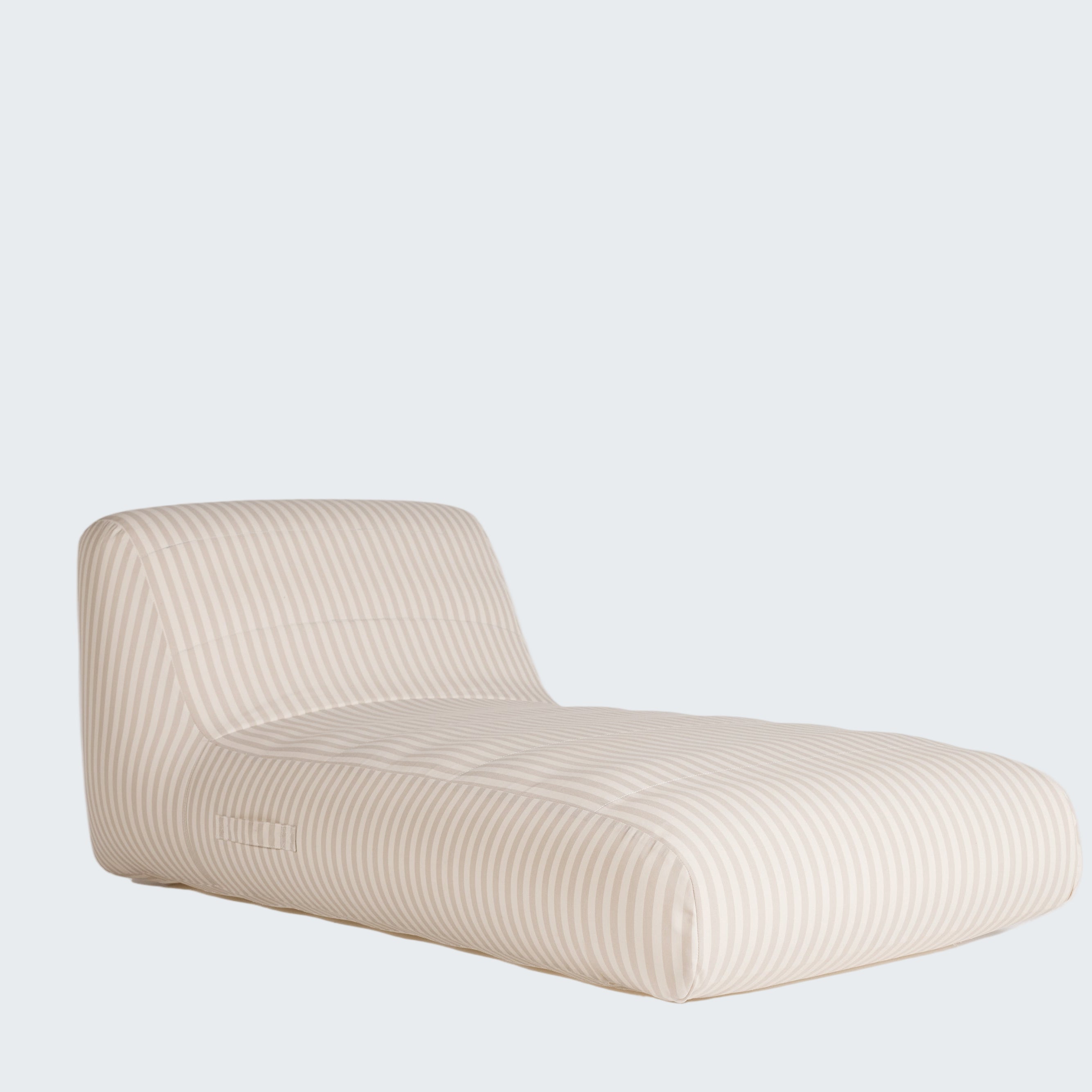 Beige lounge chair on a white background
