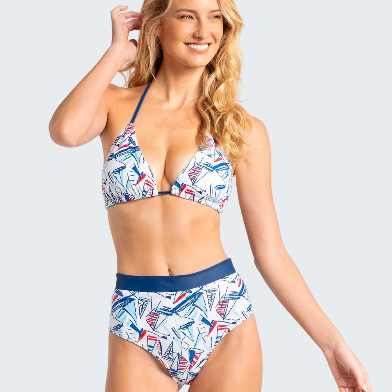 Woman wearing a patterned bikini set on a white background