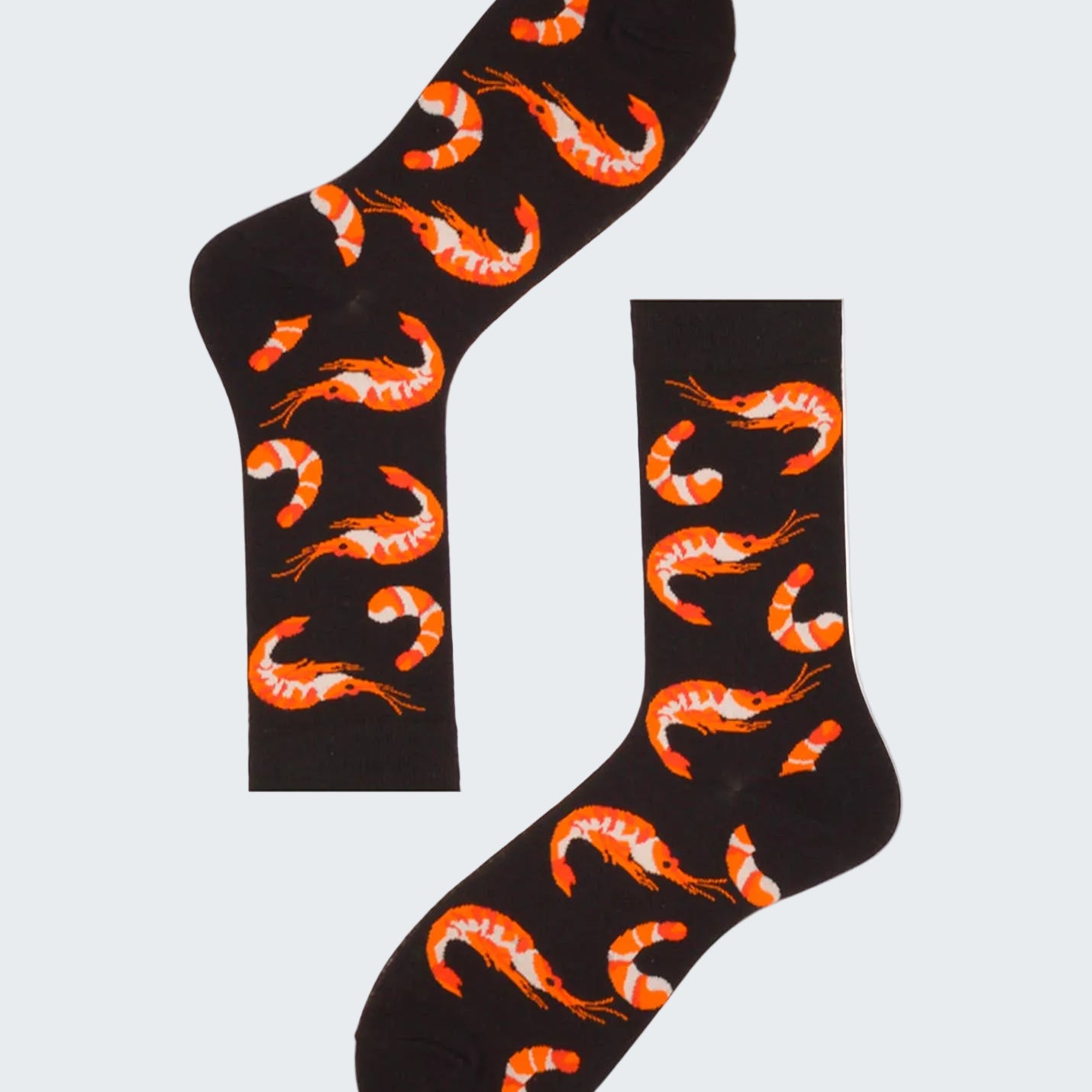 Black socks with orange shrimp pattern on a white background