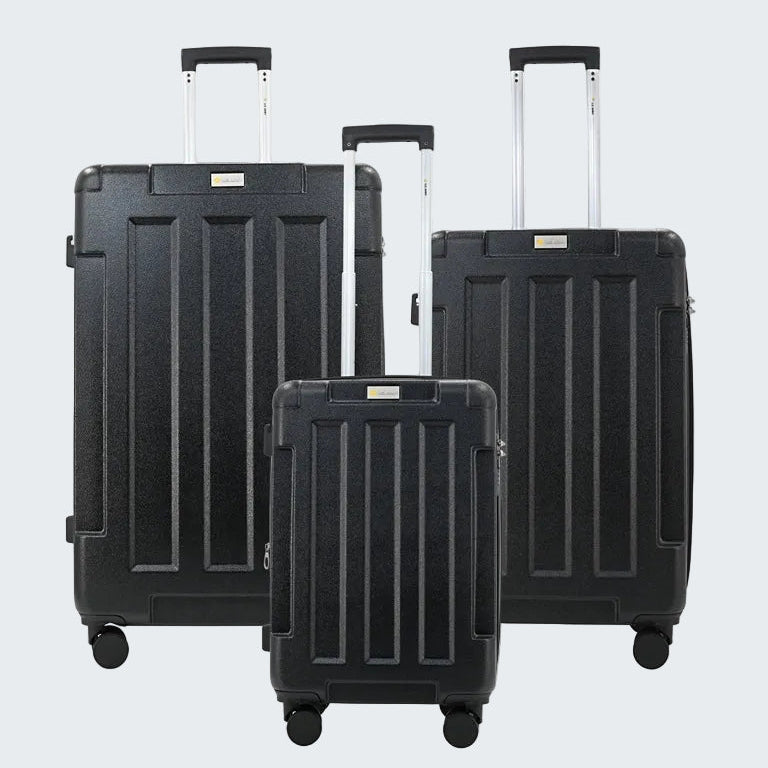 Set of three black suitcases with wheels on a white background