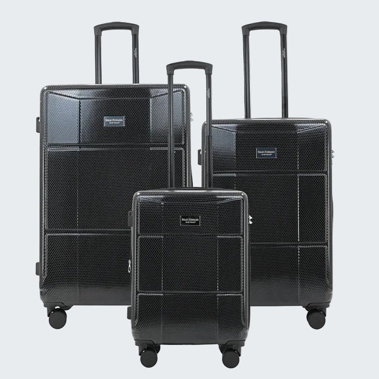Set of black suitcases with wheels on a white background