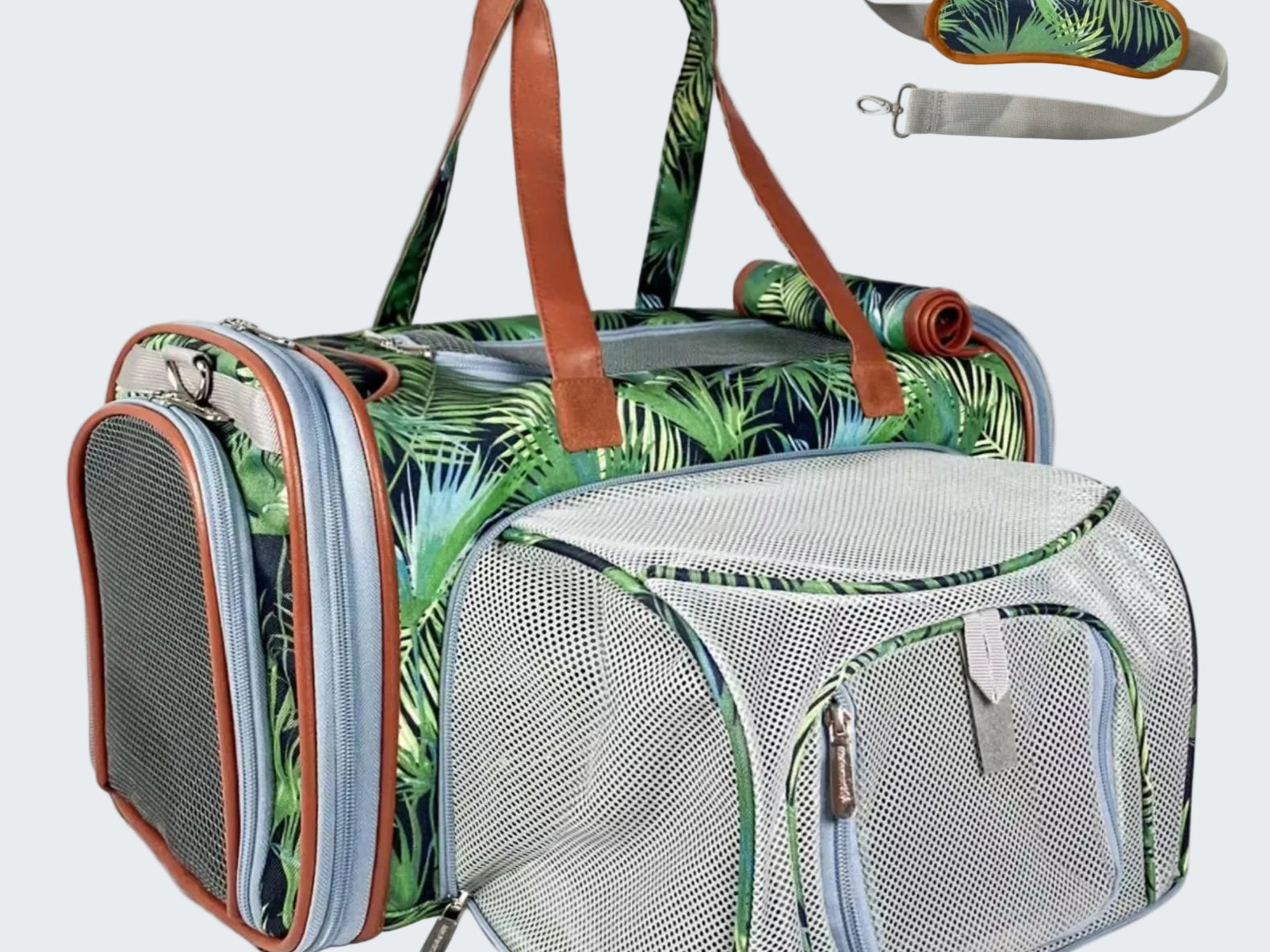 Pet carrier with tropical leaf pattern and detachable straps on a white background
