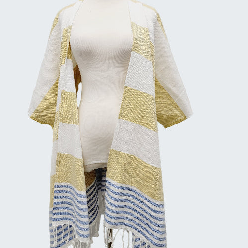 Mannequin wearing a yellow and white striped towel with blue accents on a white background