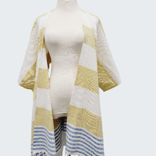 Mannequin wearing a yellow and white striped towel with blue accents on a white background