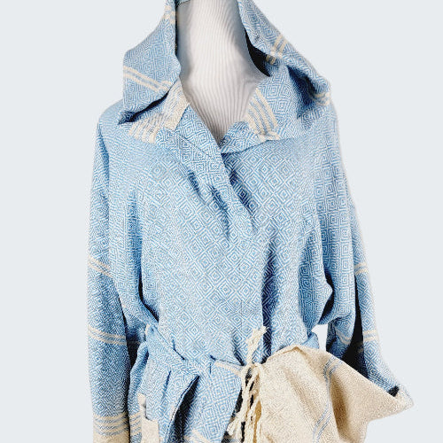 Light blue textured garment with white accents on a neutral background