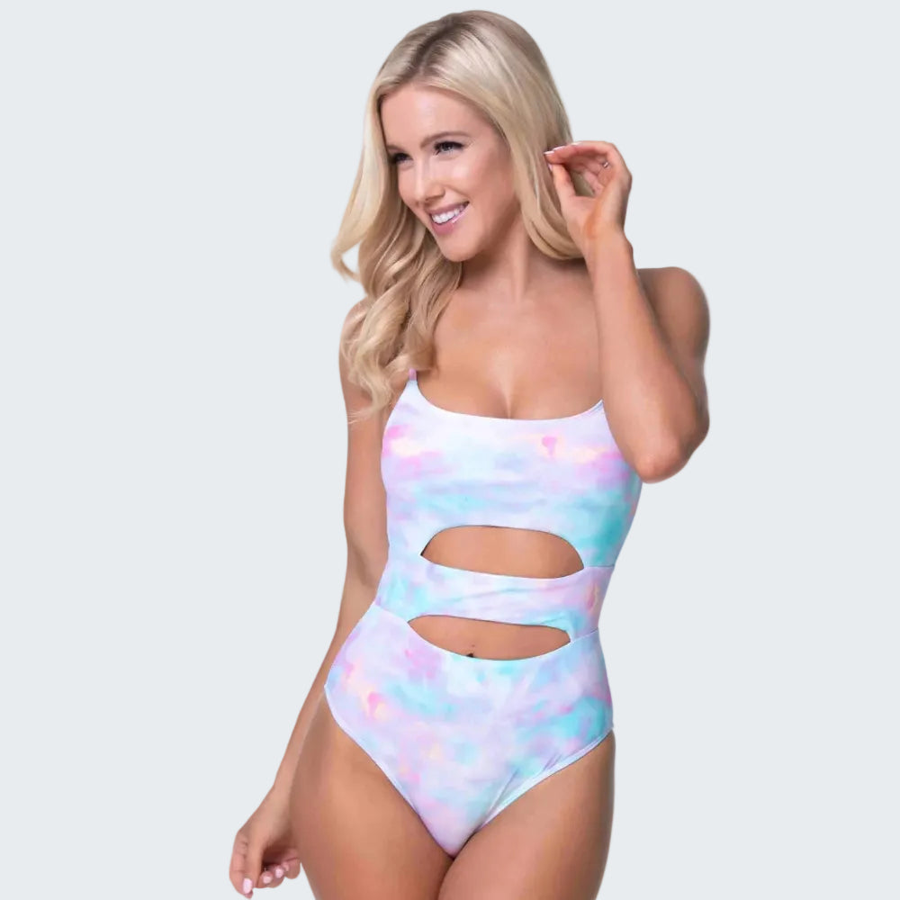 Woman wearing a colorful one-piece swimsuit on a white background