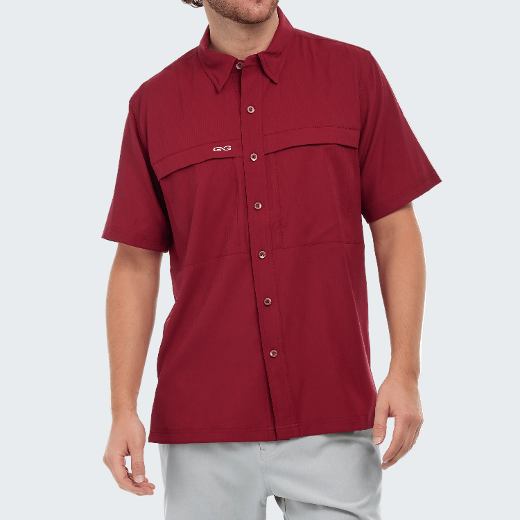 Red short-sleeve shirt worn by a person on a white background