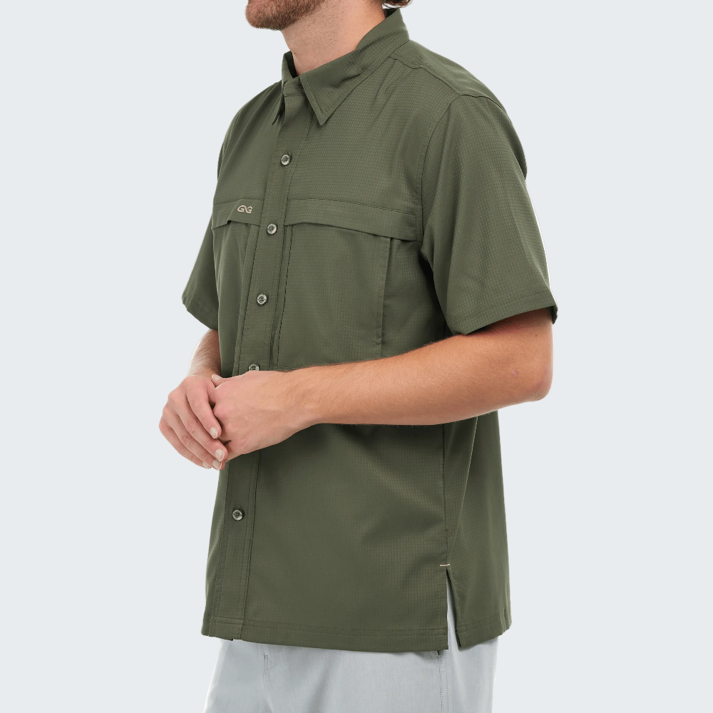 Person wearing a green short-sleeve shirt on a white background