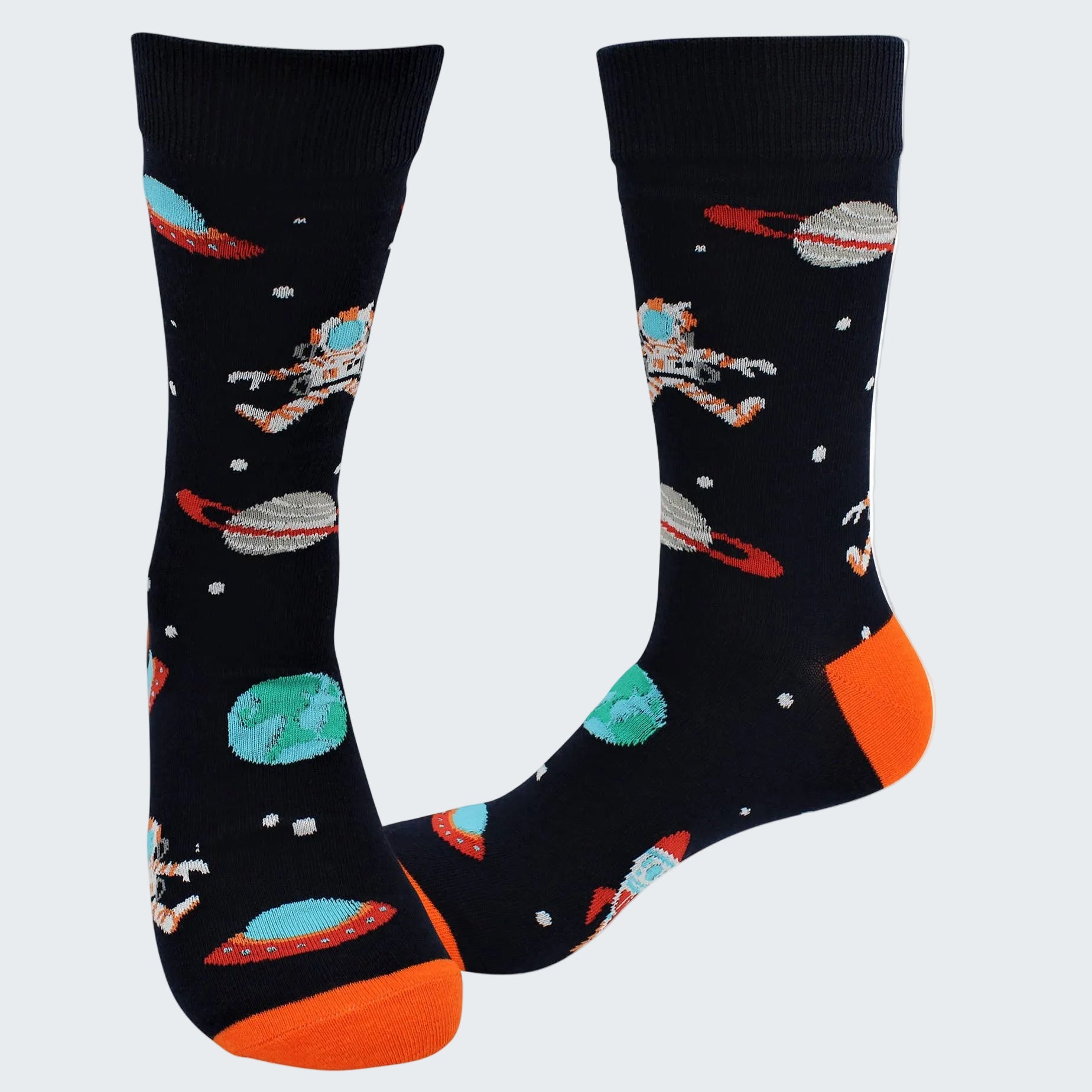 Space-themed socks with astronauts, planets, and UFOs on a black background.