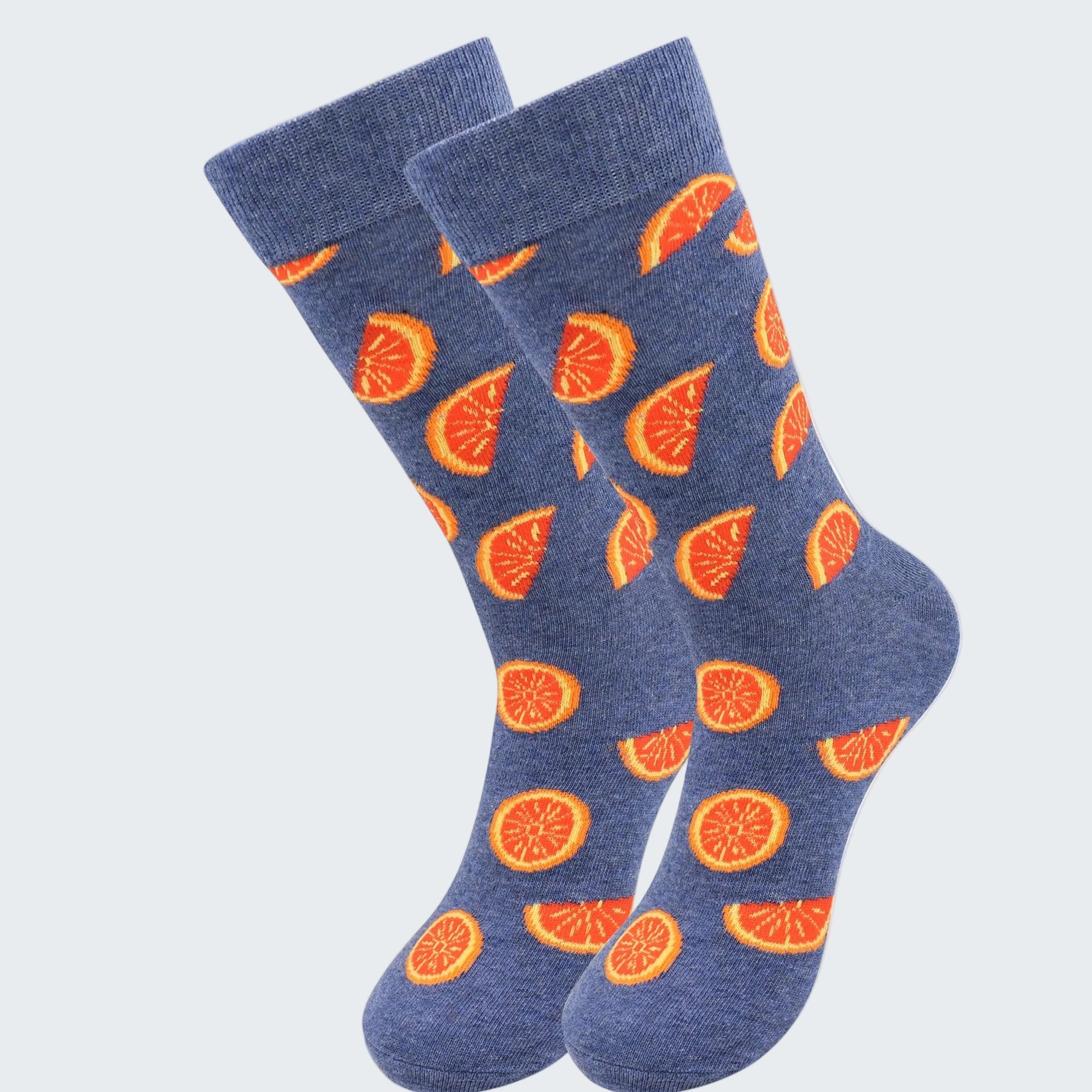Blue socks with orange fruit pattern on a white background