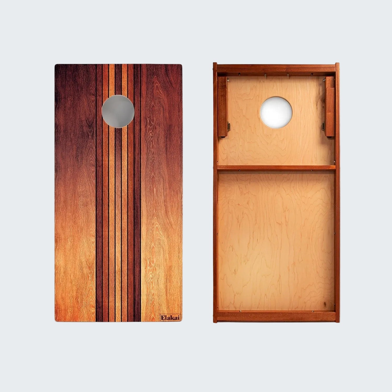 Wooden cornhole boards with striped design on a white background