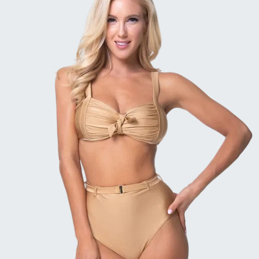 Woman wearing a beige bikini set on a white background