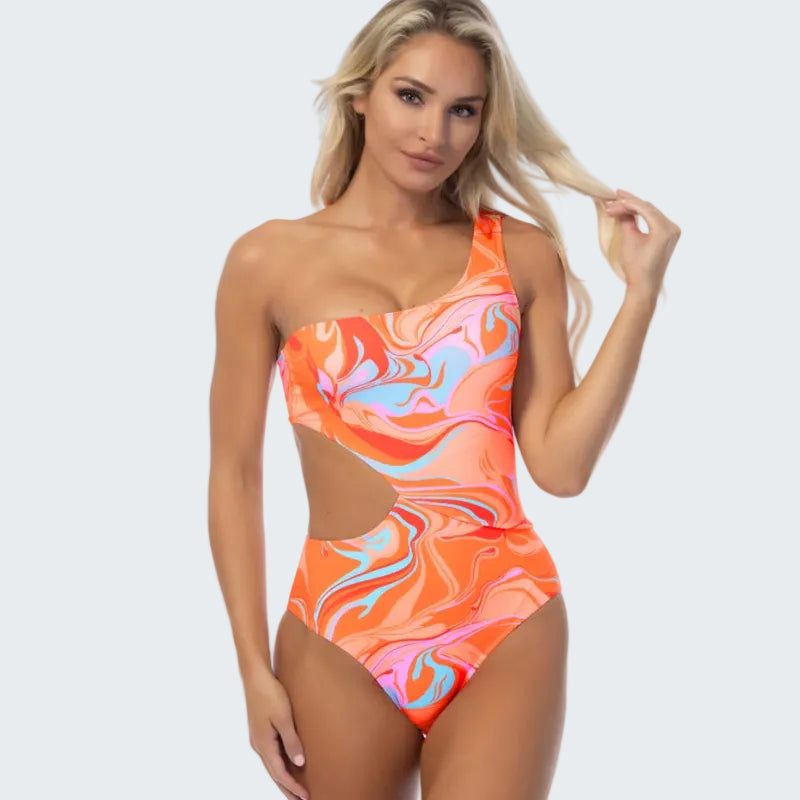 Woman wearing a colorful one-piece swimsuit on a white background