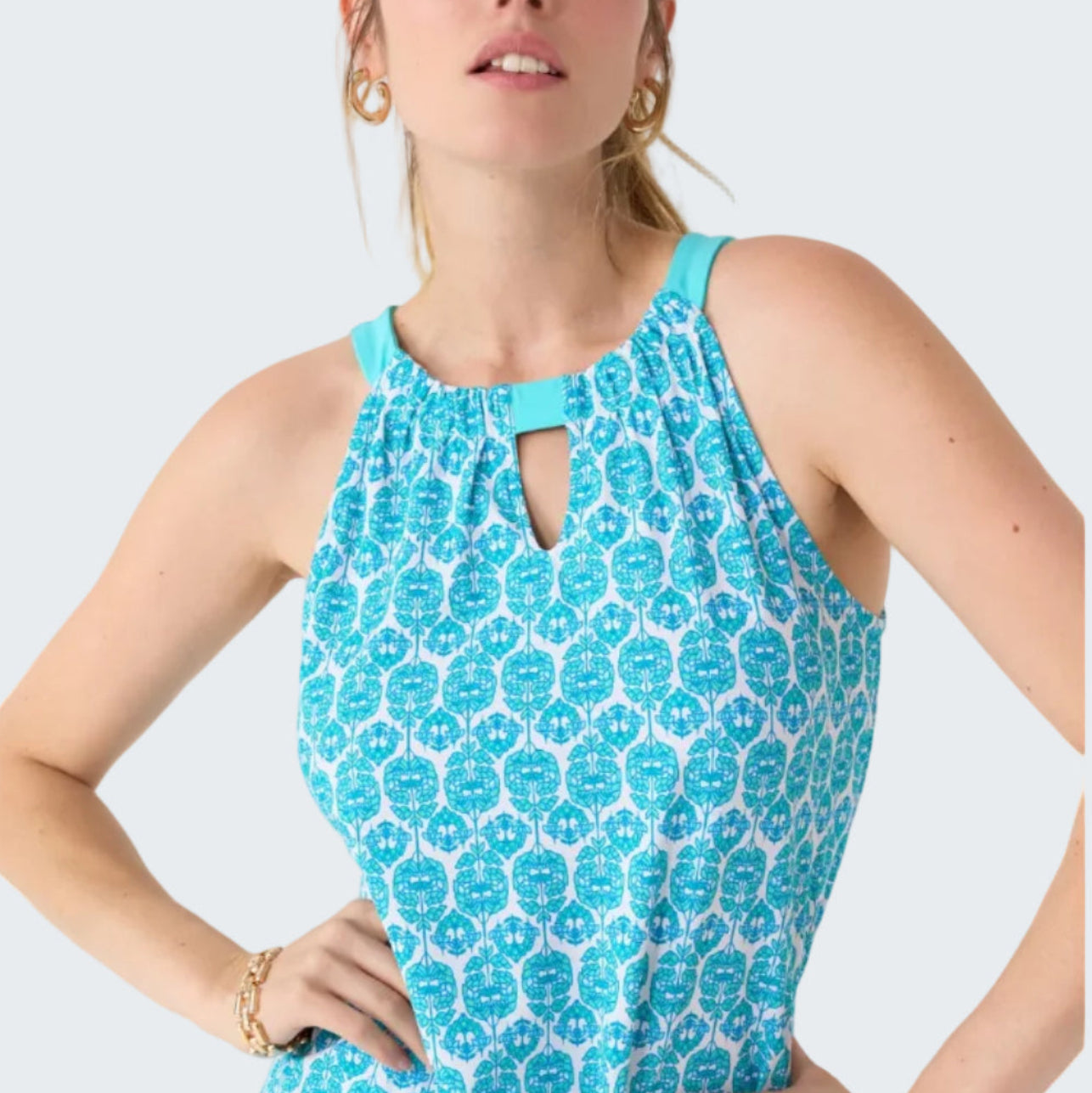 Woman wearing a blue floral dress on a white background