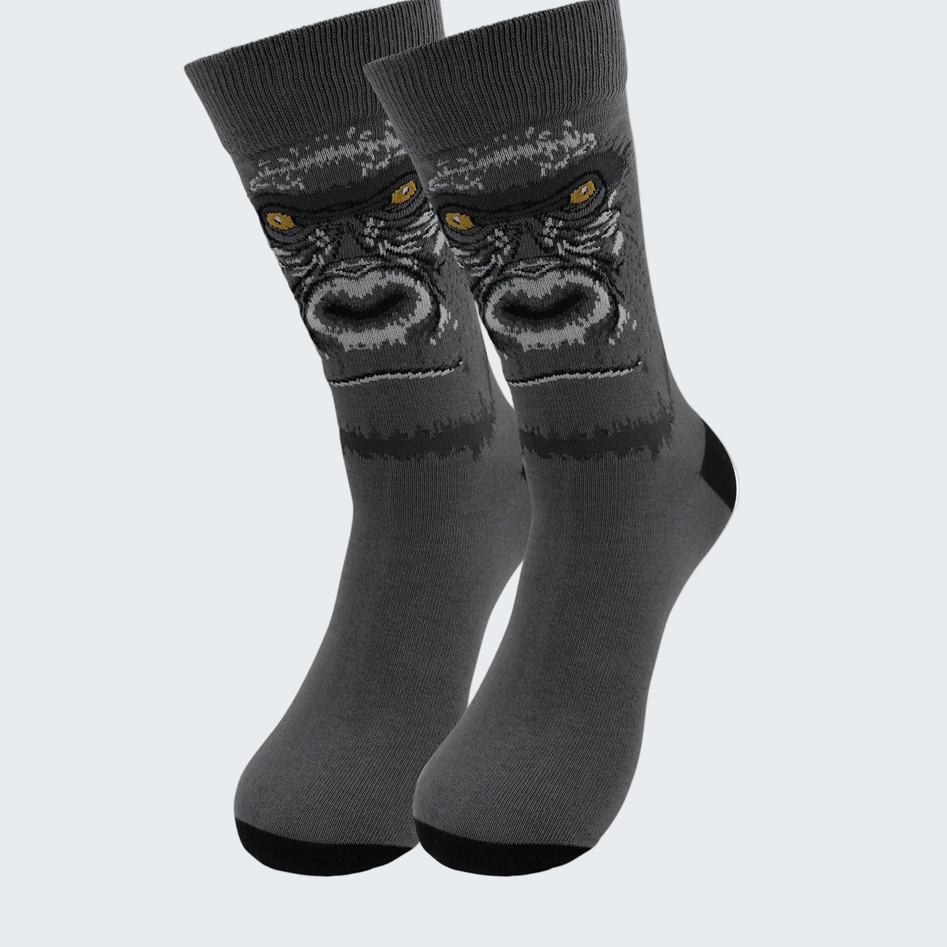 Gray socks with a gorilla design on a white background