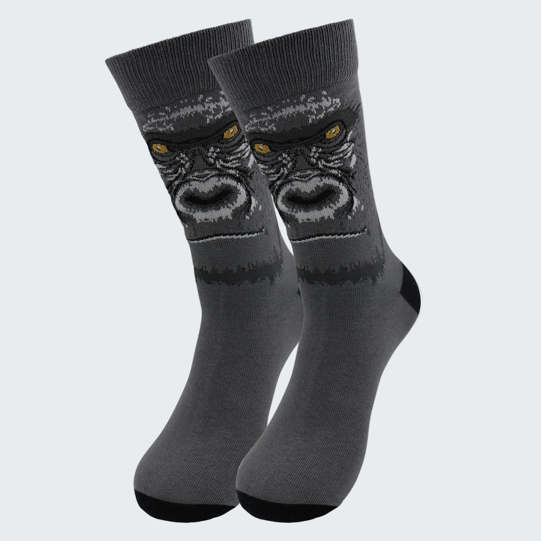 Gray socks with a gorilla design on a white background
