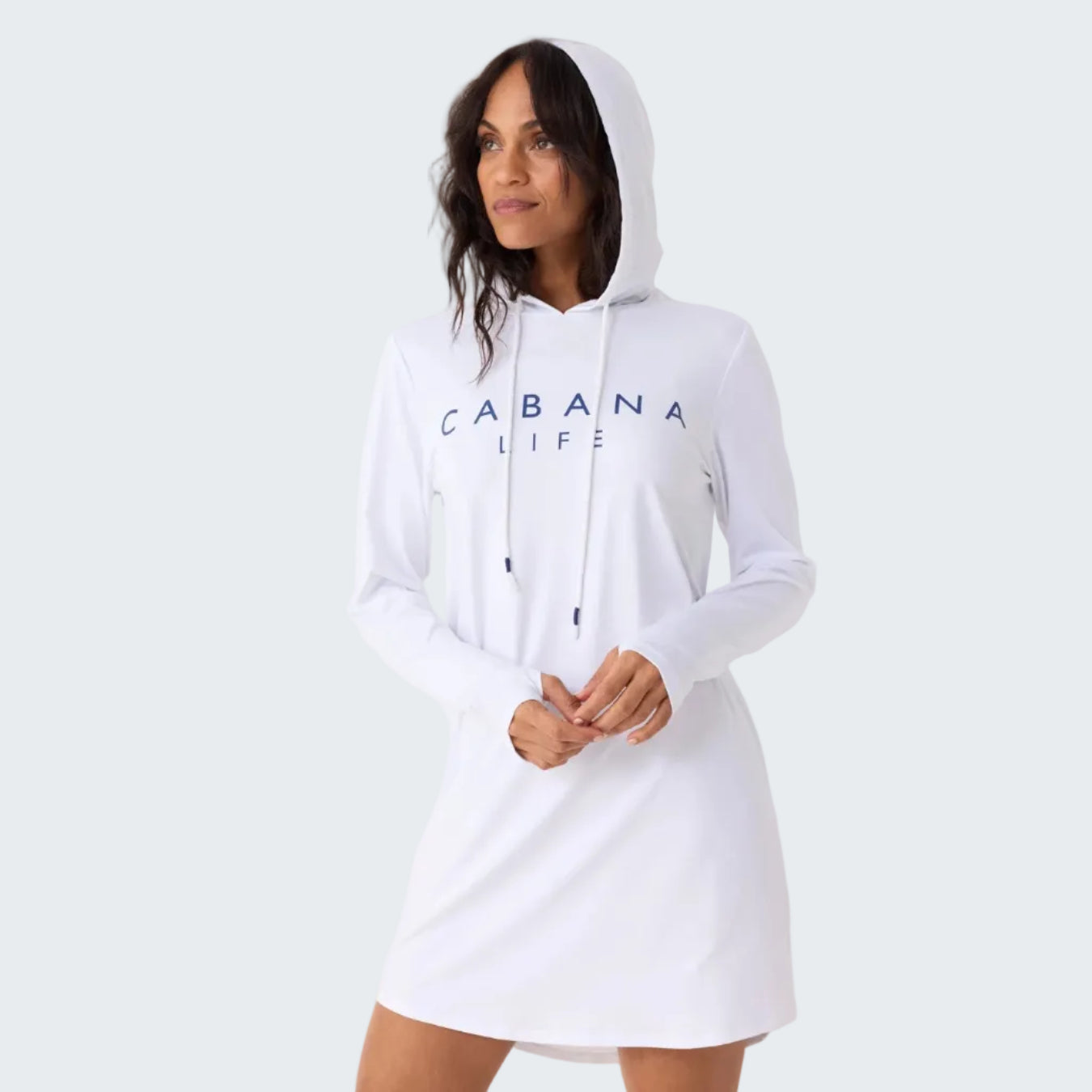 Woman wearing a white hoodie with 'CABANA LIFE' text on a plain background