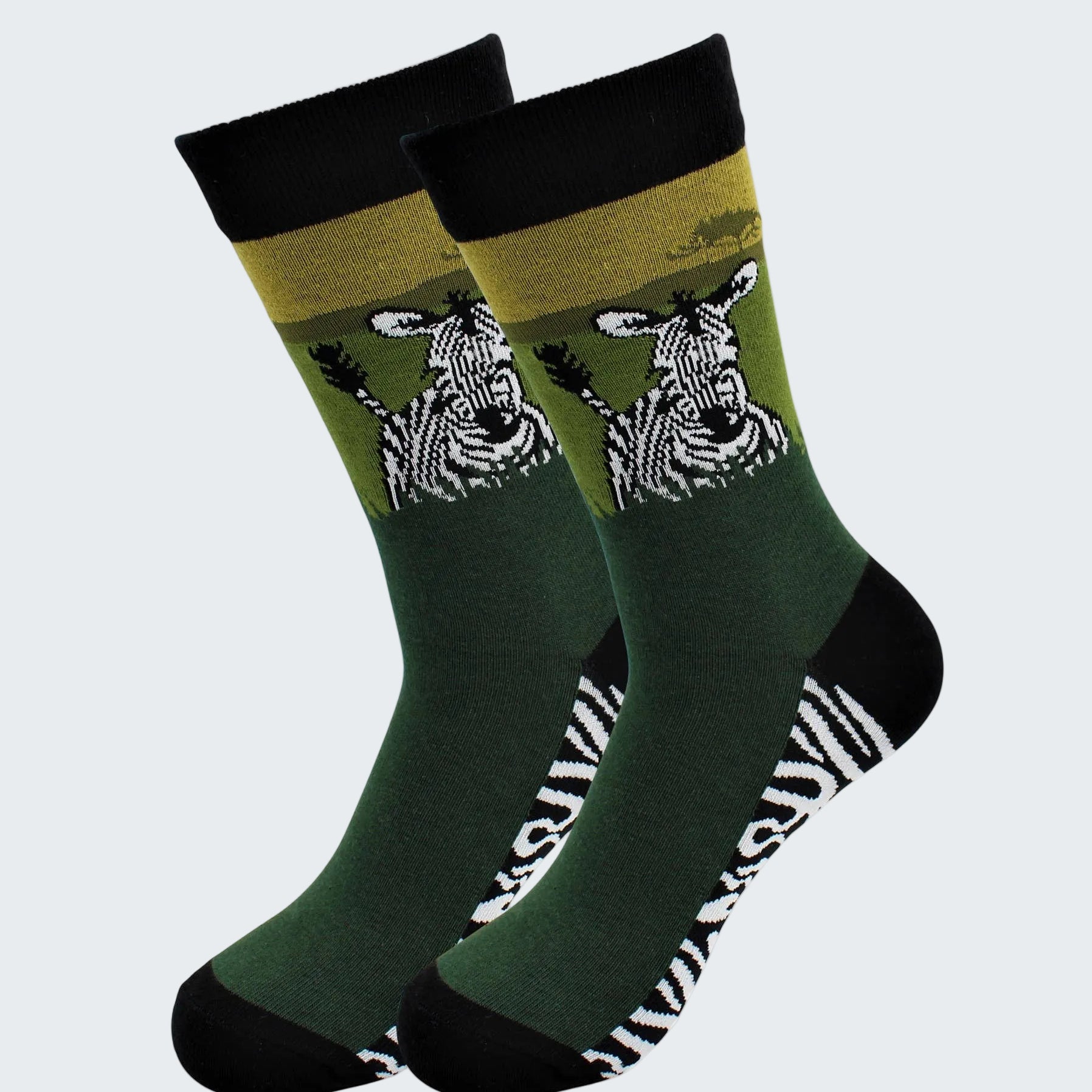 Two green socks with zebra design on a white background
