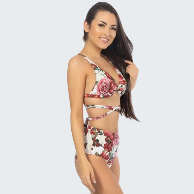 Woman wearing a floral two-piece swimsuit on a white background