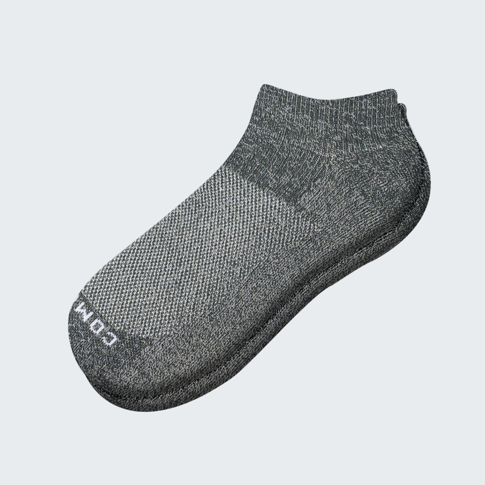 Brown tie with circular pattern on a light gray background