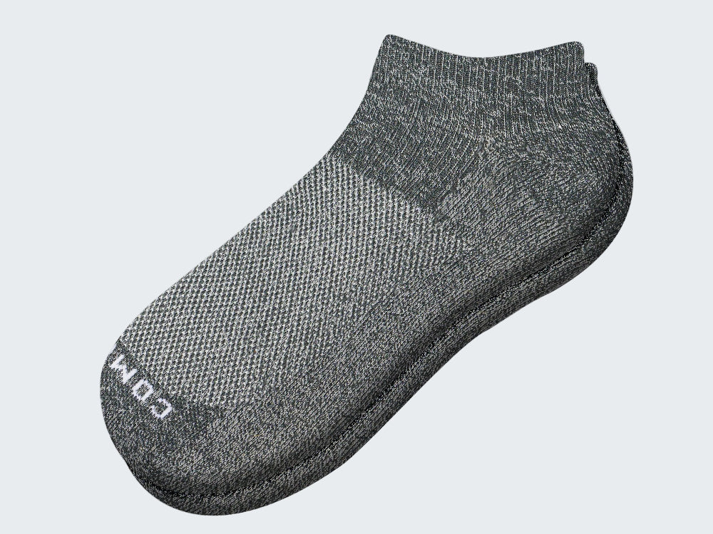 Brown tie with circular pattern on a light gray background