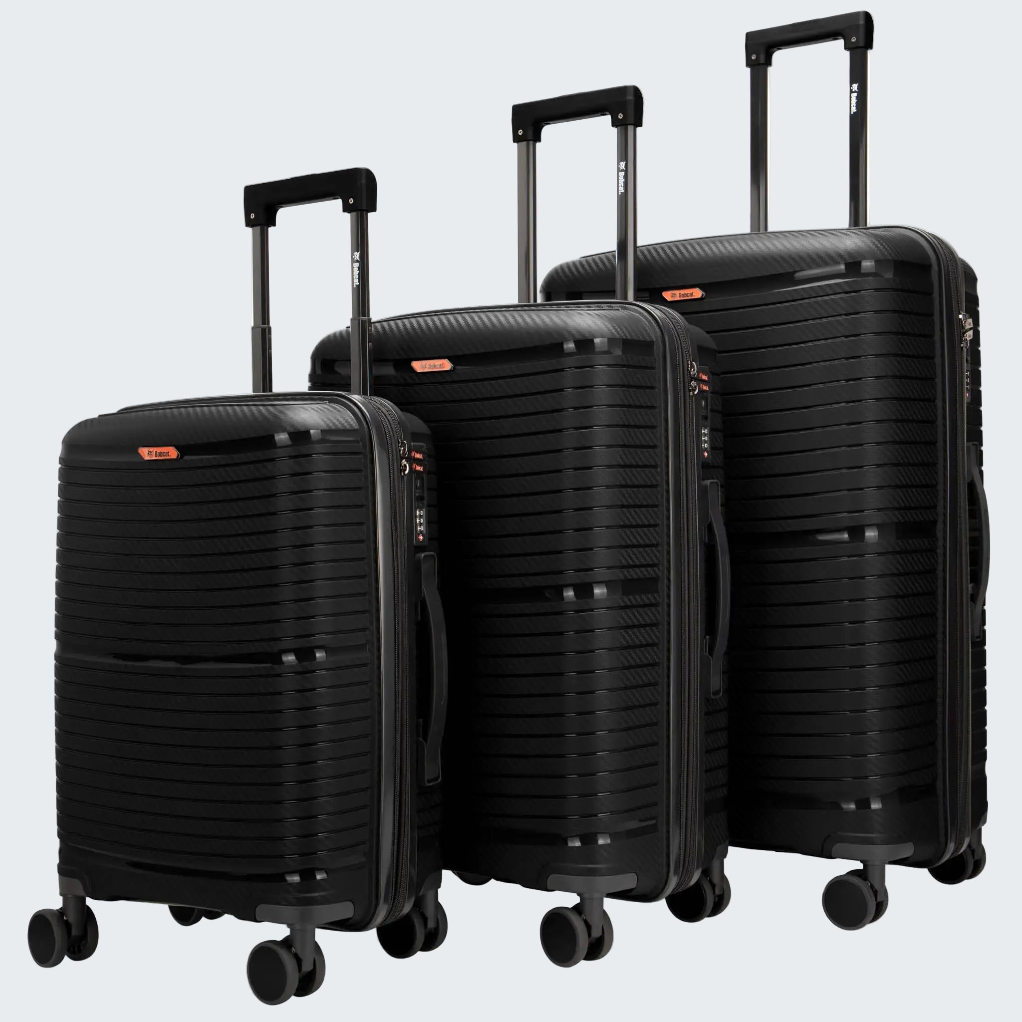 Three black suitcases of different sizes on a white background