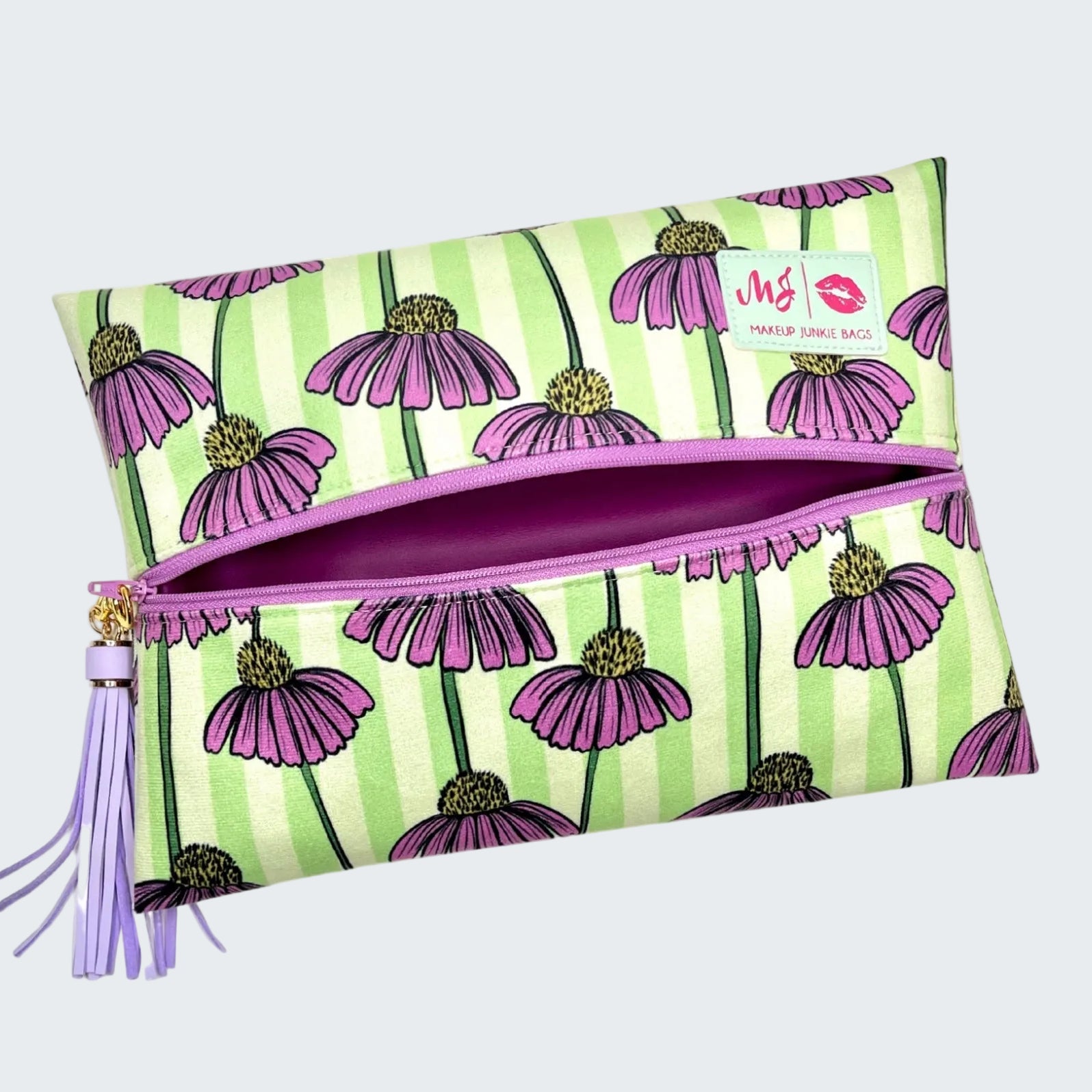 Floral patterned pouch with a tassel on a white background