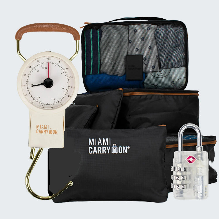 Collection of travel gear including a scale, packing cubes, and a lock with 'Miami Carry-On' branding.