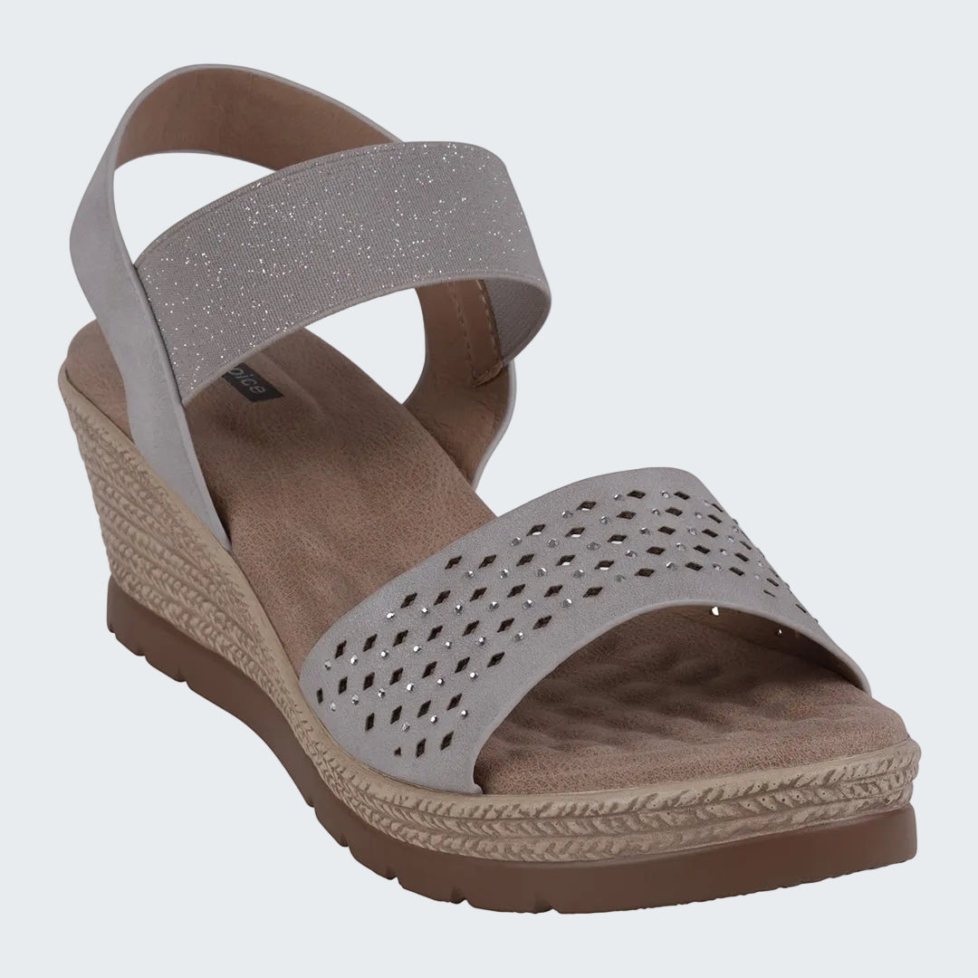 Wedge sandal with gray strap and brown sole on a white background