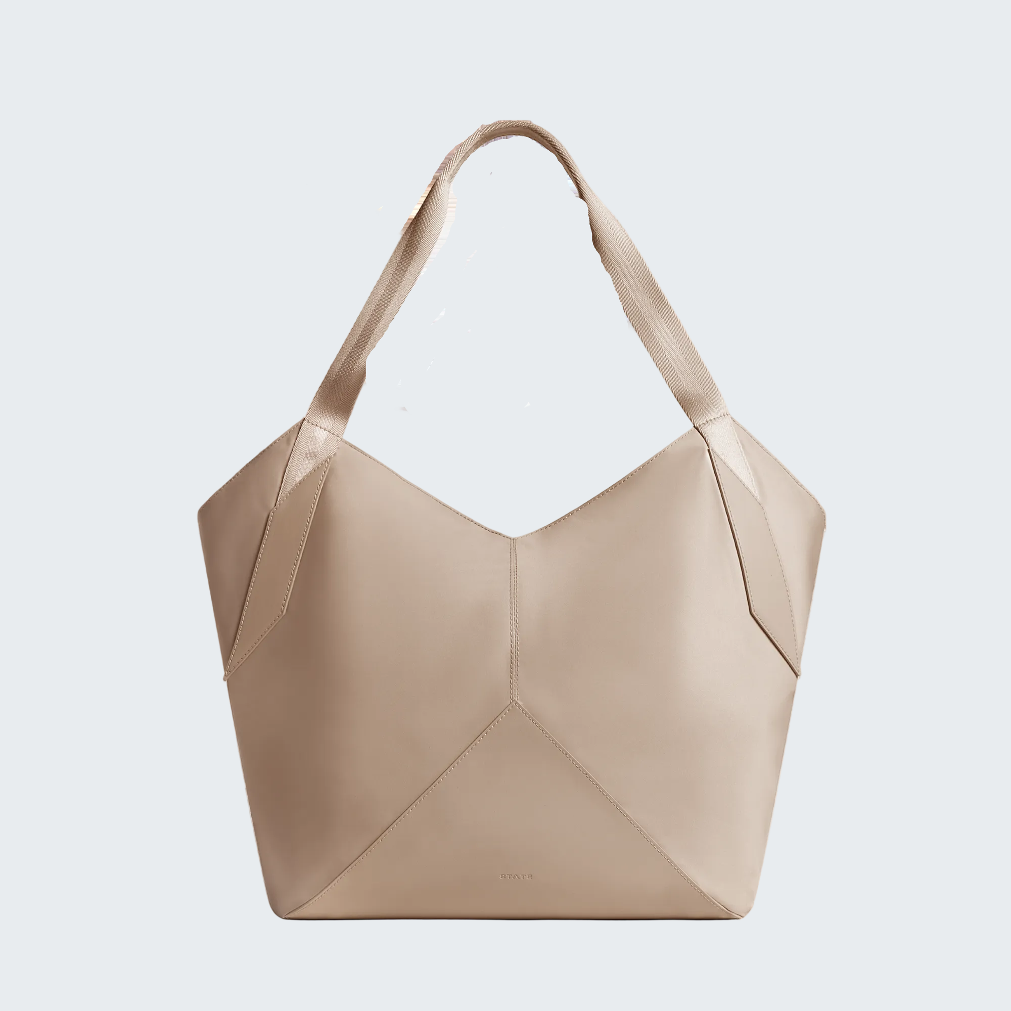 Beige handbag with a geometric design on a white background
