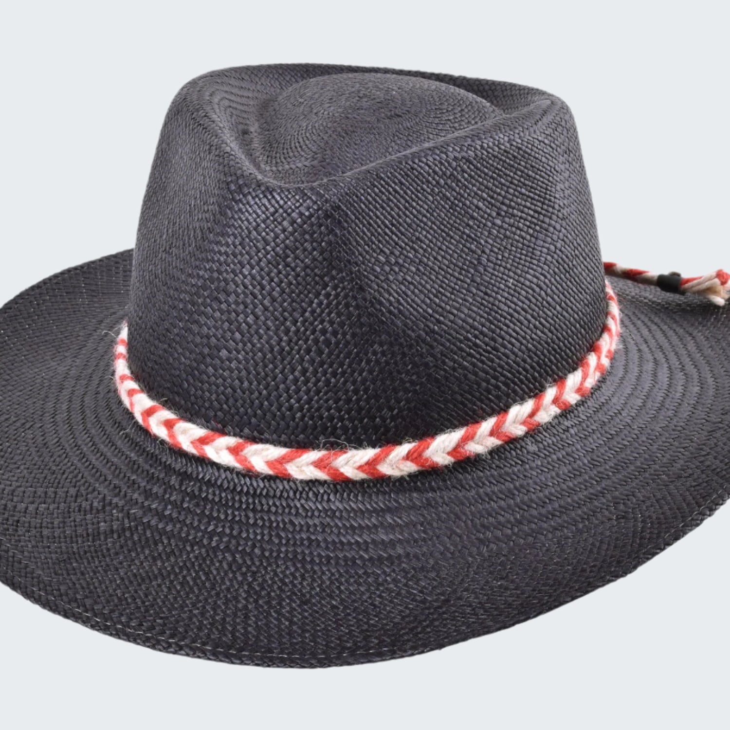 Black straw hat with a red and white striped band on a white background