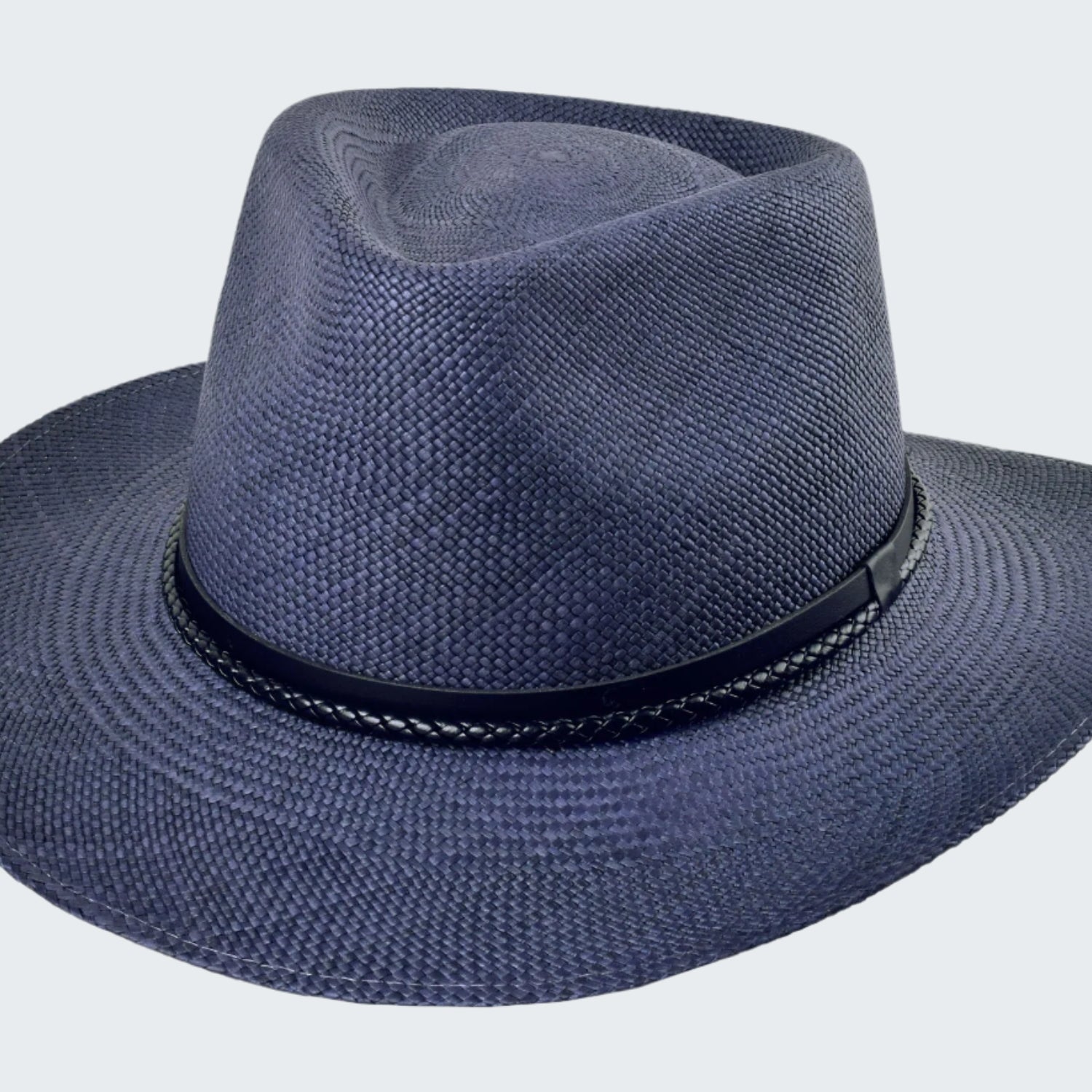 Blue straw hat with a black band on a white background