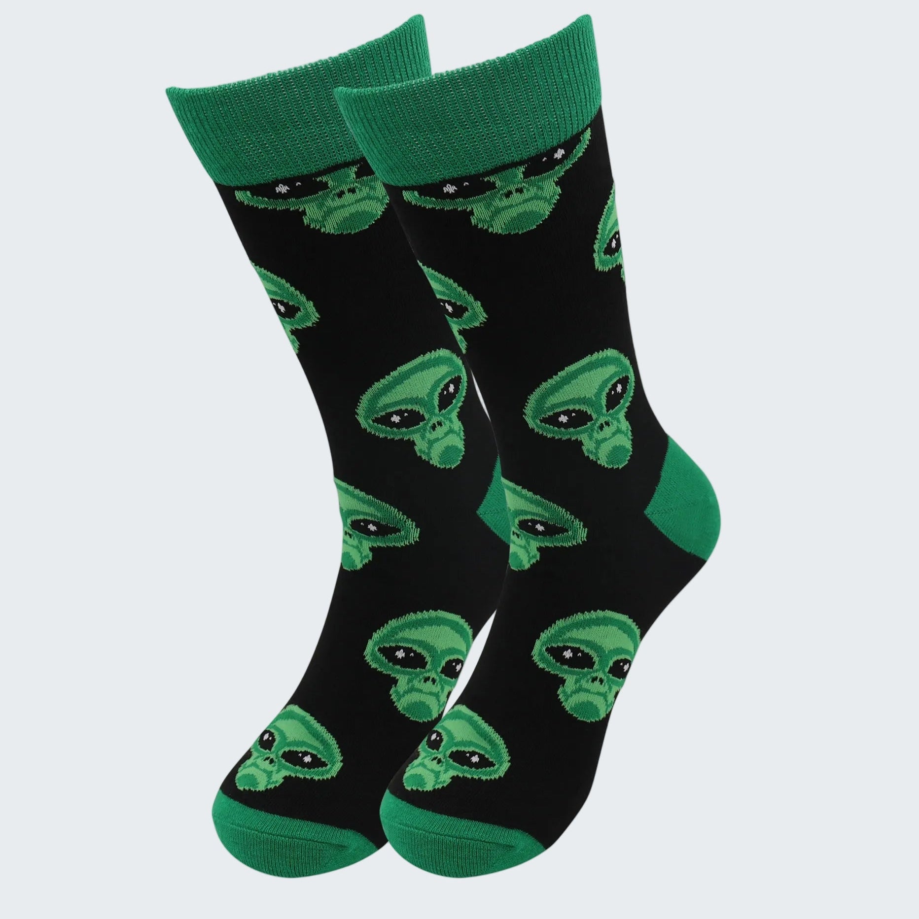 Black socks with green alien patterns on a white background
