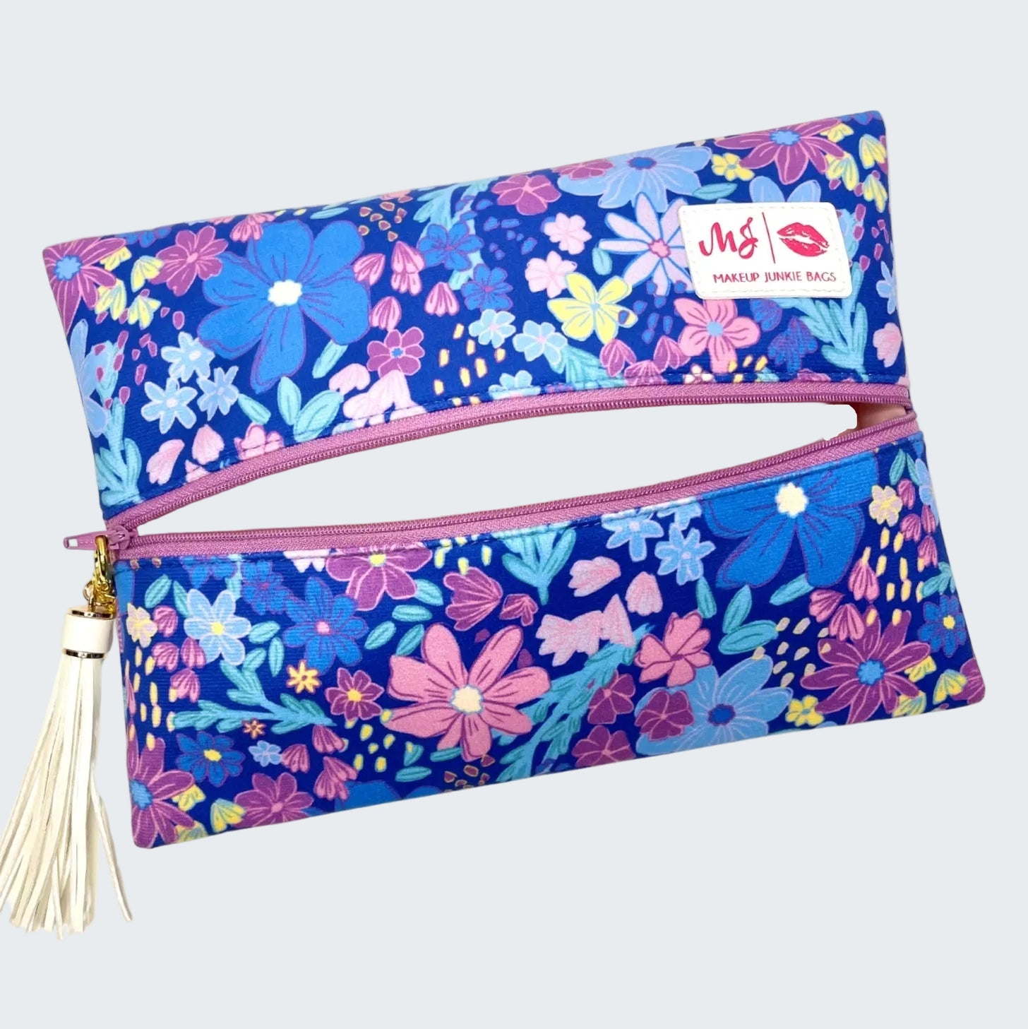 Floral-patterned makeup bag with a visible brand logo on a white background