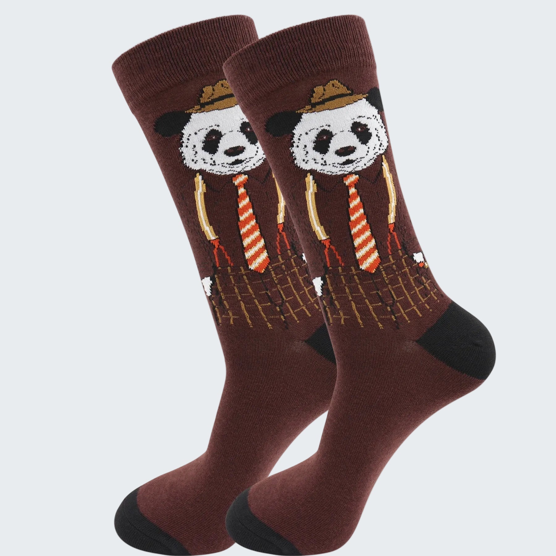Pair of socks with panda design wearing hats and ties on a white background